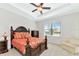 This main bedroom features a large bed and plenty of natural light at 13026 Ramblewood Trl, Bradenton, FL 34211