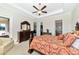 This main bedroom features a large bed and plenty of storage at 13026 Ramblewood Trl, Bradenton, FL 34211
