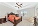 The primary bedroom boasts a decorative bed frame, side tables, dressers, and serene natural lighting at 13026 Ramblewood Trl, Bradenton, FL 34211