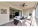Screened patio with outdoor seating and view to interior living spaces at 13026 Ramblewood Trl, Bradenton, FL 34211