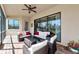 Relaxing screened patio includes lounge furniture and a picturesque lake view at 13026 Ramblewood Trl, Bradenton, FL 34211