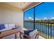 Balcony with seating area overlooking scenic lake views at 13714 Messina Loop # 202, Bradenton, FL 34211