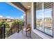 Relaxing balcony view with a rocking chair and an expansive view of neighborhood at 13714 Messina Loop # 202, Bradenton, FL 34211