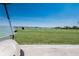 Scenic view of a well-manicured golf driving range with lake views at 13714 Messina Loop # 202, Bradenton, FL 34211