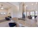 Spacious kitchen boasts granite countertops, bar seating, and stainless steel appliances, open to living area at 13714 Messina Loop # 202, Bradenton, FL 34211