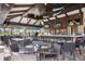 Open-air restaurant featuring a full bar, televisions, decorative fish, and comfortable seating at 13714 Messina Loop # 202, Bradenton, FL 34211
