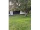 An inviting backyard featuring a covered patio perfect for relaxing or entertaining outdoors at 1725 Briar Creek Ln, Sarasota, FL 34235