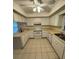 Functional kitchen with white cabinets and essential appliances at 1725 Briar Creek Ln, Sarasota, FL 34235