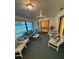 Spacious lanai with comfortable seating, a dining area, and plenty of natural light, great for entertaining at 1725 Briar Creek Ln, Sarasota, FL 34235