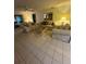 Bright living room featuring comfortable seating, tile flooring, and ample natural light at 1725 Briar Creek Ln, Sarasota, FL 34235
