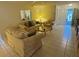 Comfortable living room with tile floors and classic decor at 1725 Briar Creek Ln, Sarasota, FL 34235