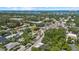 Aerial view of the property, surrounding neighborhood, and nearby city and bay at 1857 Siesta Dr, Sarasota, FL 34239