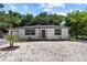 Charming single-story home boasting a well-manicured front yard, enhancing its curb appeal at 1857 Siesta Dr, Sarasota, FL 34239
