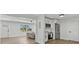 Inviting kitchen seamlessly connects to a cozy living area, complete with modern appliances and ample counter space at 1857 Siesta Dr, Sarasota, FL 34239