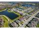 Wide aerial perspective of the neighborhood showcasing the home's proximity to the lake and community amenities at 19293 Breynia Dr, Lutz, FL 33558