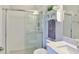 This bathroom features a glass shower, floating shelf and a gray marble sink at 19293 Breynia Dr, Lutz, FL 33558