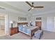 This bedroom has beautiful wood furniture, great lighting, and a calm mood at 19293 Breynia Dr, Lutz, FL 33558