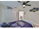 This bedroom has New York Yankees decor and a large ceiling fan at 19293 Breynia Dr, Lutz, FL 33558