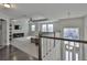 The living room has many windows, a ceiling fan, and is right above the entryway at 19293 Breynia Dr, Lutz, FL 33558