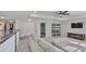 This open-concept living room is bright with light and includes a ceiling fan at 19293 Breynia Dr, Lutz, FL 33558