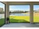 A beautiful lake view from the screened in patio, offering a serene outdoor living space at 19293 Breynia Dr, Lutz, FL 33558