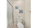 Bathroom featuring a tiled shower and toilet at 19369 Nearpoint Dr, Venice, FL 34292