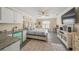 Bedroom featuring a comfortable bed, kitchenette, and a dedicated workspace at 19369 Nearpoint Dr, Venice, FL 34292