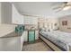 Bright bedroom with kitchenette featuring modern fixtures, and comfortable bed at 19369 Nearpoint Dr, Venice, FL 34292