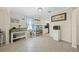 Dining area with fish tanks, tile floors, and modern decor, located near the kitchen and other living spaces at 19369 Nearpoint Dr, Venice, FL 34292