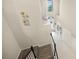 View of the entryway and foyer with a staircase, tile floors, decor, and natural light from the windows above at 19369 Nearpoint Dr, Venice, FL 34292