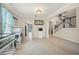 Open-concept hallway with a staircase, tile flooring, and fish tanks in the dining area, providing seamless flow at 19369 Nearpoint Dr, Venice, FL 34292