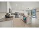Bright kitchen with granite countertops, stainless appliances, and an island with a sink at 19369 Nearpoint Dr, Venice, FL 34292