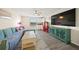 Living room with a comfy couch, large TV, and a kitchenette with a retro fridge at 19369 Nearpoint Dr, Venice, FL 34292