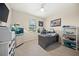 Bright home office featuring a large desk, aquarium, and ample natural light from the window at 19369 Nearpoint Dr, Venice, FL 34292