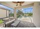 Relaxing screened patio overlooking a swimming pool, hot tub, and verdant landscaping at 19369 Nearpoint Dr, Venice, FL 34292