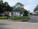 Charming single-story home with a cozy front porch, nestled on a tree-lined street corner lot at 2102 Arlington St, Sarasota, FL 34239