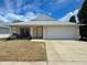 Charming single-story home featuring a two-car garage and a cozy front porch at 2122 Pleasure Run Dr, Ruskin, FL 33570