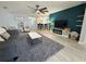 Bright living room with hardwood floors, bar seating, and a decorative wall at 2122 Pleasure Run Dr, Ruskin, FL 33570