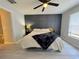 Relaxing main bedroom with a decorative headboard wall and hardwood floors at 2122 Pleasure Run Dr, Ruskin, FL 33570