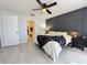 Stylish main bedroom featuring modern decor, hardwood floors, and ensuite bath at 2122 Pleasure Run Dr, Ruskin, FL 33570