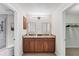 Bathroom featuring a double vanity with granite countertops and modern lighting fixtures at 2237 Sadnet Ln, North Port, FL 34286