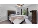 Bedroom with plush carpeting, large window, ceiling fan, and neutral wall paint at 2237 Sadnet Ln, North Port, FL 34286