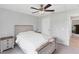 Well-lit bedroom with a ceiling fan, and a cozy blanket draped over the bed at 2237 Sadnet Ln, North Port, FL 34286