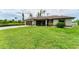 Beautiful single-story home featuring a well-manicured lawn, screened entry and a two-car garage at 2237 Sadnet Ln, North Port, FL 34286