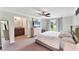 Serene main bedroom with neutral tones, a large window, and an en-suite bathroom at 2237 Sadnet Ln, North Port, FL 34286