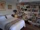 Bedroom with a cozy bed, ceiling fan, wall art, and built-in shelving for books and decor at 2411 Quail Ct, Bradenton, FL 34209