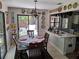 Dining room area with a table, chairs, and an open view to an outdoor patio at 2411 Quail Ct, Bradenton, FL 34209
