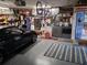 Organized garage space with a laundry area, storage shelves, and space for a car or workshop at 2411 Quail Ct, Bradenton, FL 34209