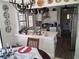 Bright kitchen with stainless steel appliances, pendant lights, and a breakfast bar at 2411 Quail Ct, Bradenton, FL 34209