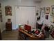 Office space with a classic wood desk, ample storage, and plenty of room to personalize at 2411 Quail Ct, Bradenton, FL 34209